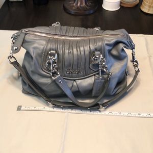 Gray leather Coach purse with silver details